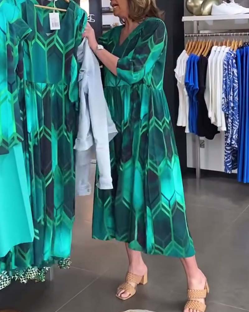 Vrouwelijke Jurk met V-hals en Bloemenprint - StudioMarella