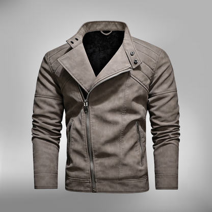 De Kovora winterjack in een stijlvolle grijze kleur heeft een moderne snit met een asymmetrische rits en een hoge kraag, ontworpen voor een strakke look. Het jack is voorzien van praktische zakken en is gemaakt van duurzame materialen, waardoor het perfect is voor zowel casual als formele winteroutfits. Het comfortabele ontwerp biedt warmte en bescherming tegen kou tijdens het koude seizoen.