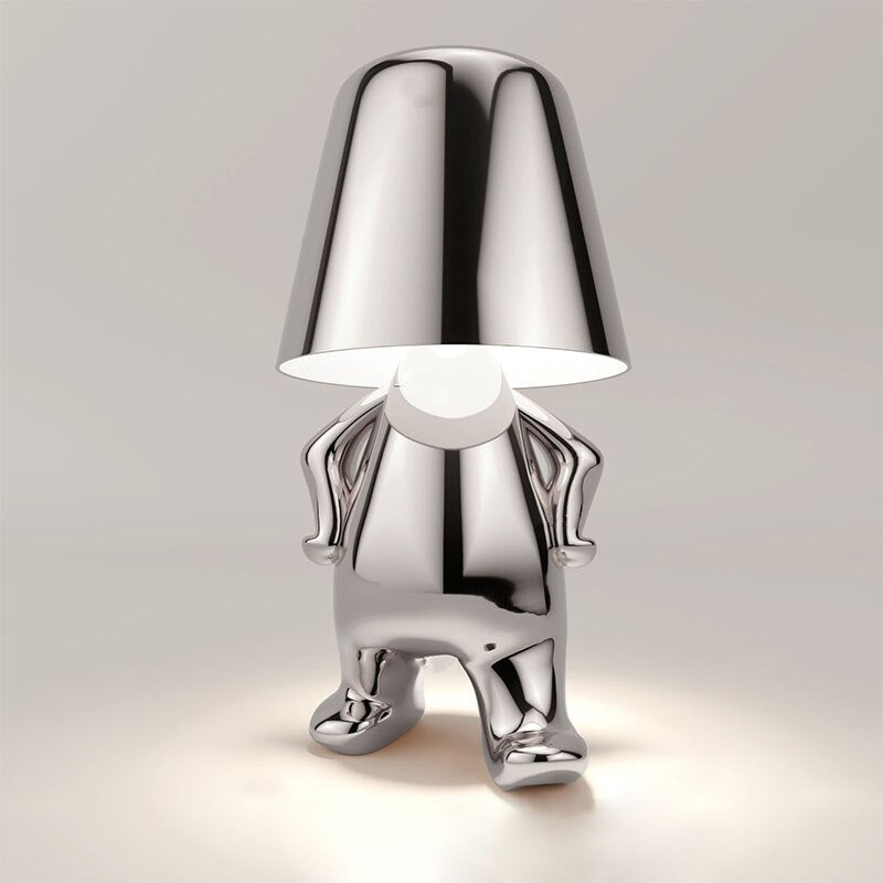 Moderne zilveren Lumineer tafellamp met een speels en creatief ontwerp, perfect voor flexibele verlichting en een unieke aanvulling op elk interieur.