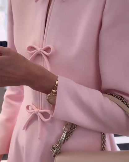 Arial | Effen kleur elegante jurk met strikken in de kleur Roze voor dames in stijl ideaal voor de herfst.