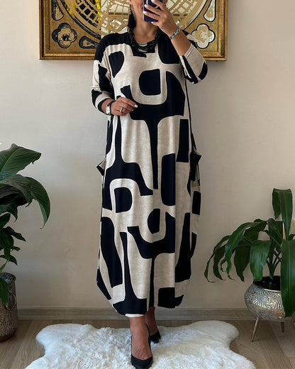 Jurk met lange mouwen en zwart witte print in de kleur Zwart voor dames in stijl ideaal voor de herfst.